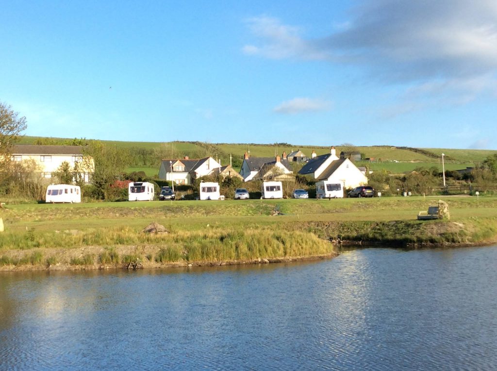 caravans against the hill backdrop